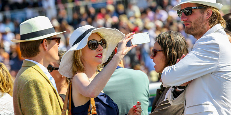 Couple dressed up and kentucky derby taking a selfie