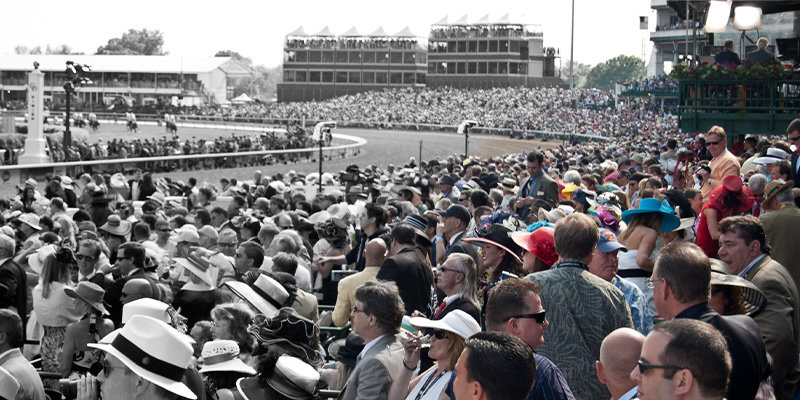 crowd of people in the grandstands of Churchill Downs