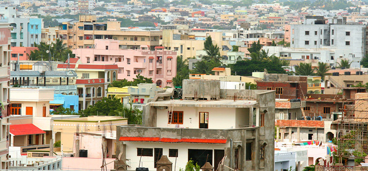 view of concrete block homes and apartments in india